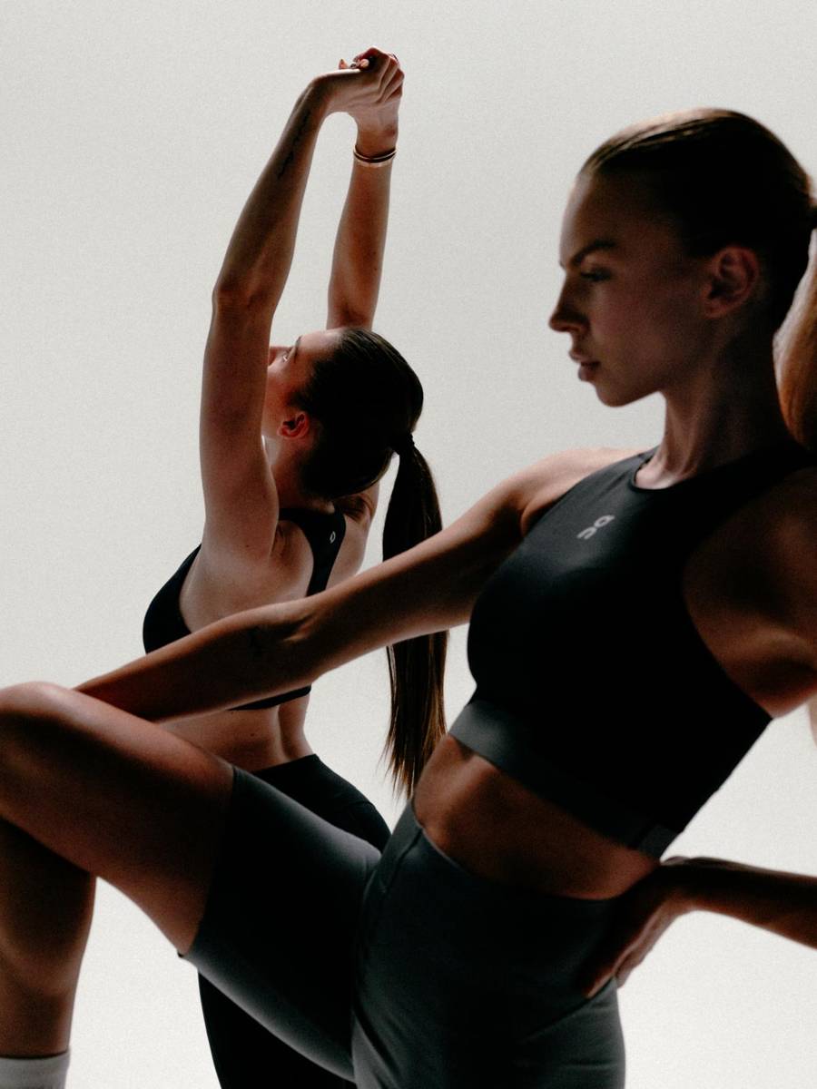Standing Pilates balance with arms overhead
